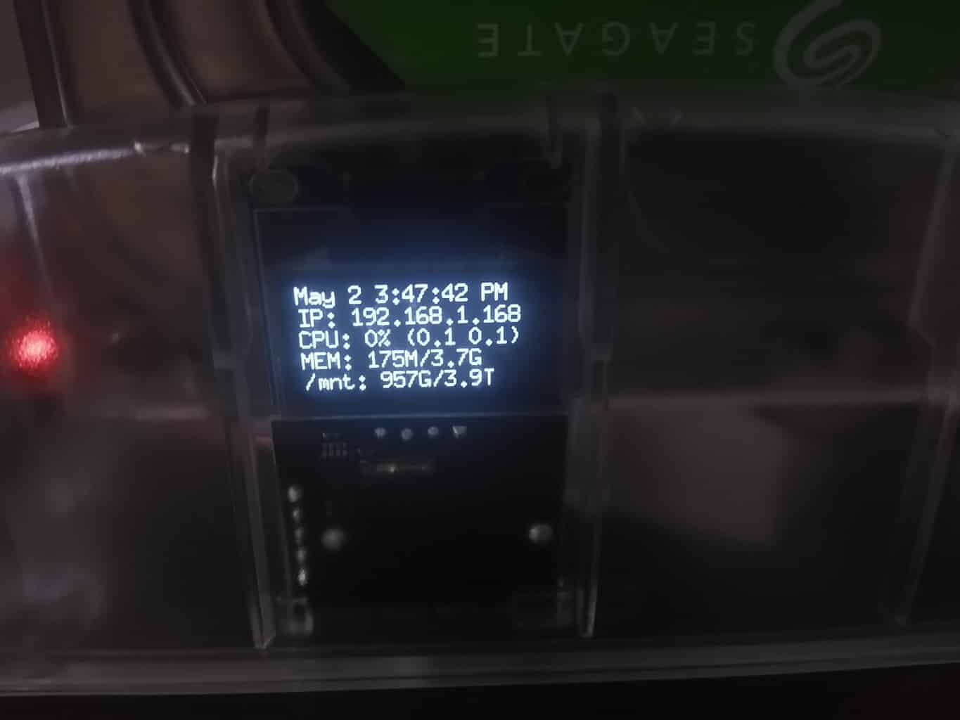 the OLED display with system stats showing